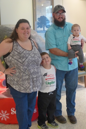 Chelsey and Michael Yeargin of Ponchatoula attend the annual NICU reunion with their sons Cayden and Cameron. Mrs. Yeargin made the boys special shirts celebrating the event.
